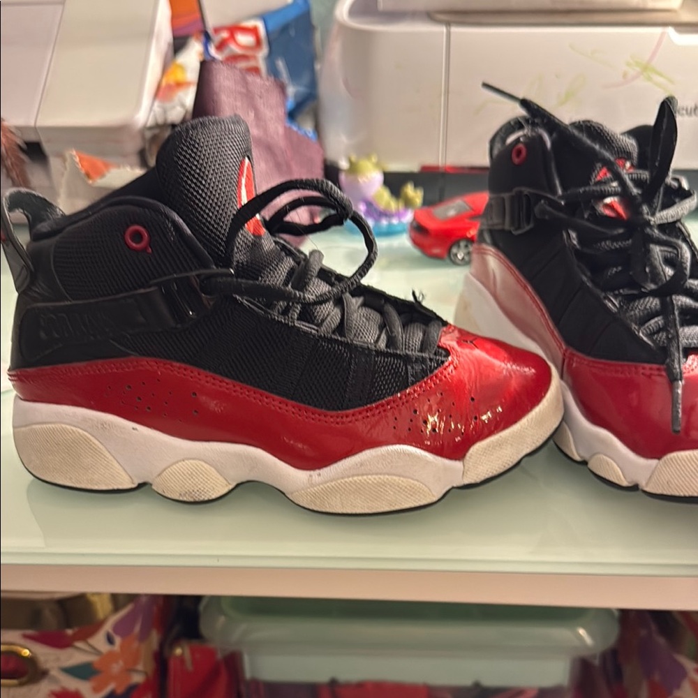 Black and Red Jordan Sneakers with Athletic Silhouette
